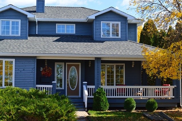 Blue-colored home with a front porch