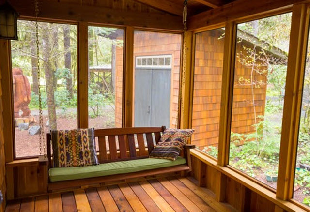 Screened-in porch idea with suspended swing