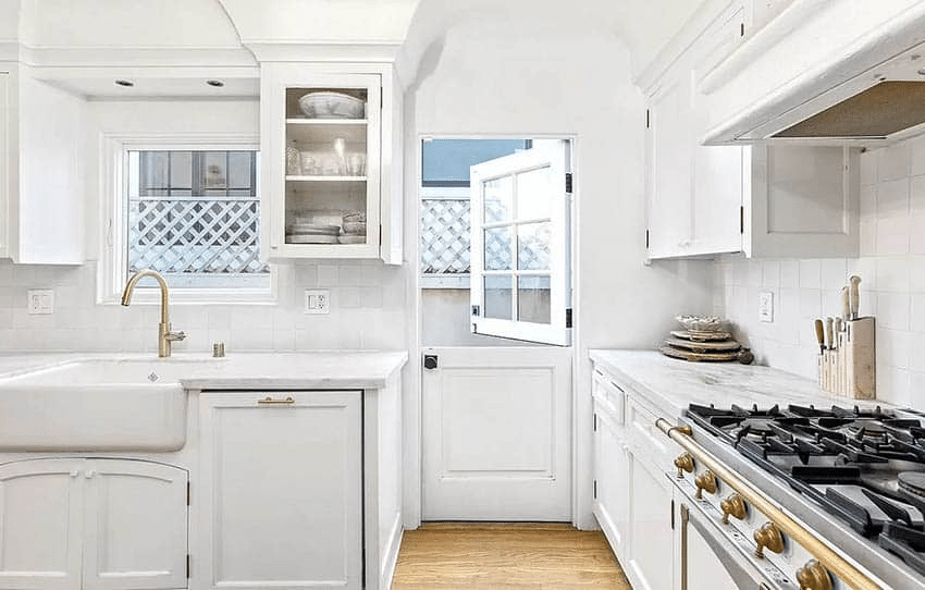 A white Dutch door used as a kitchen’s backdoor