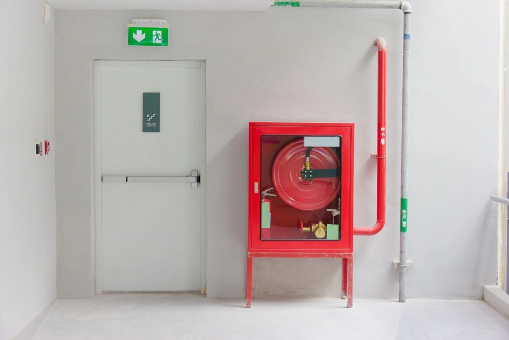 Fire extinguishing equipment next to a fire exit