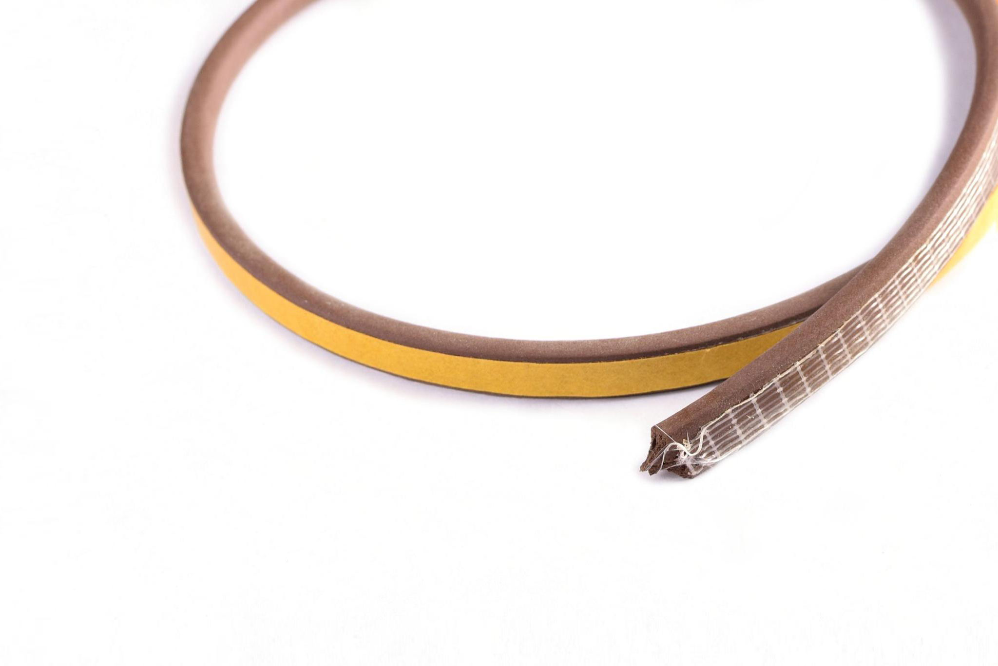 Close up of foam-type weatherstripping on a white background