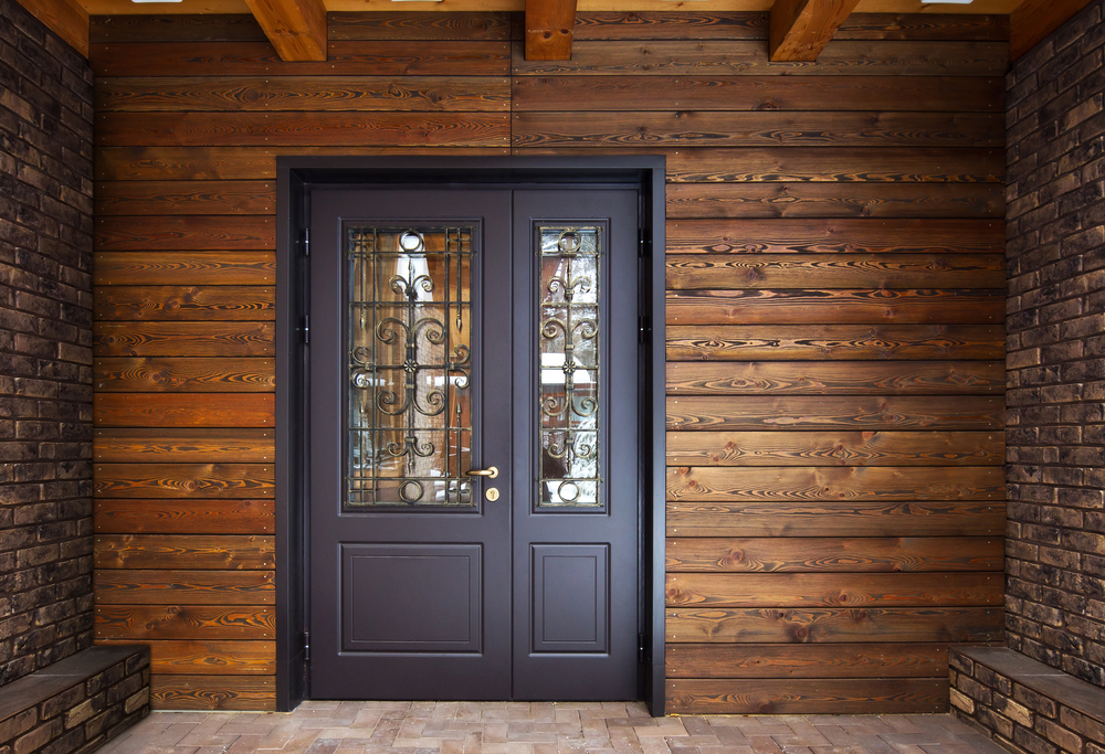 Steel door set against wooden walls