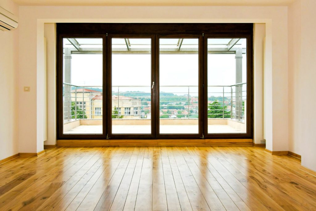 Hinged patio doors leading to a balcony
