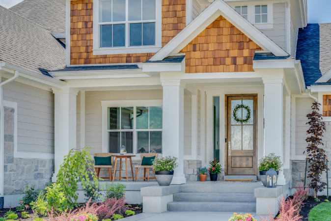 The entrance of a home with a custom exterior door and front porch