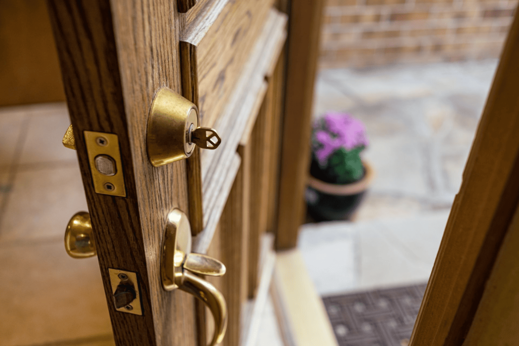 A close-up of a door’s handle, locks, and other hardware features.