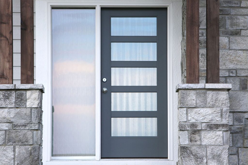 A modern steel entry door with a full sidelight