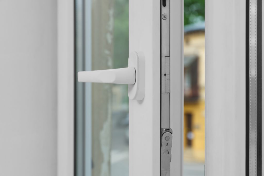 Close-up of a casement window partially open 