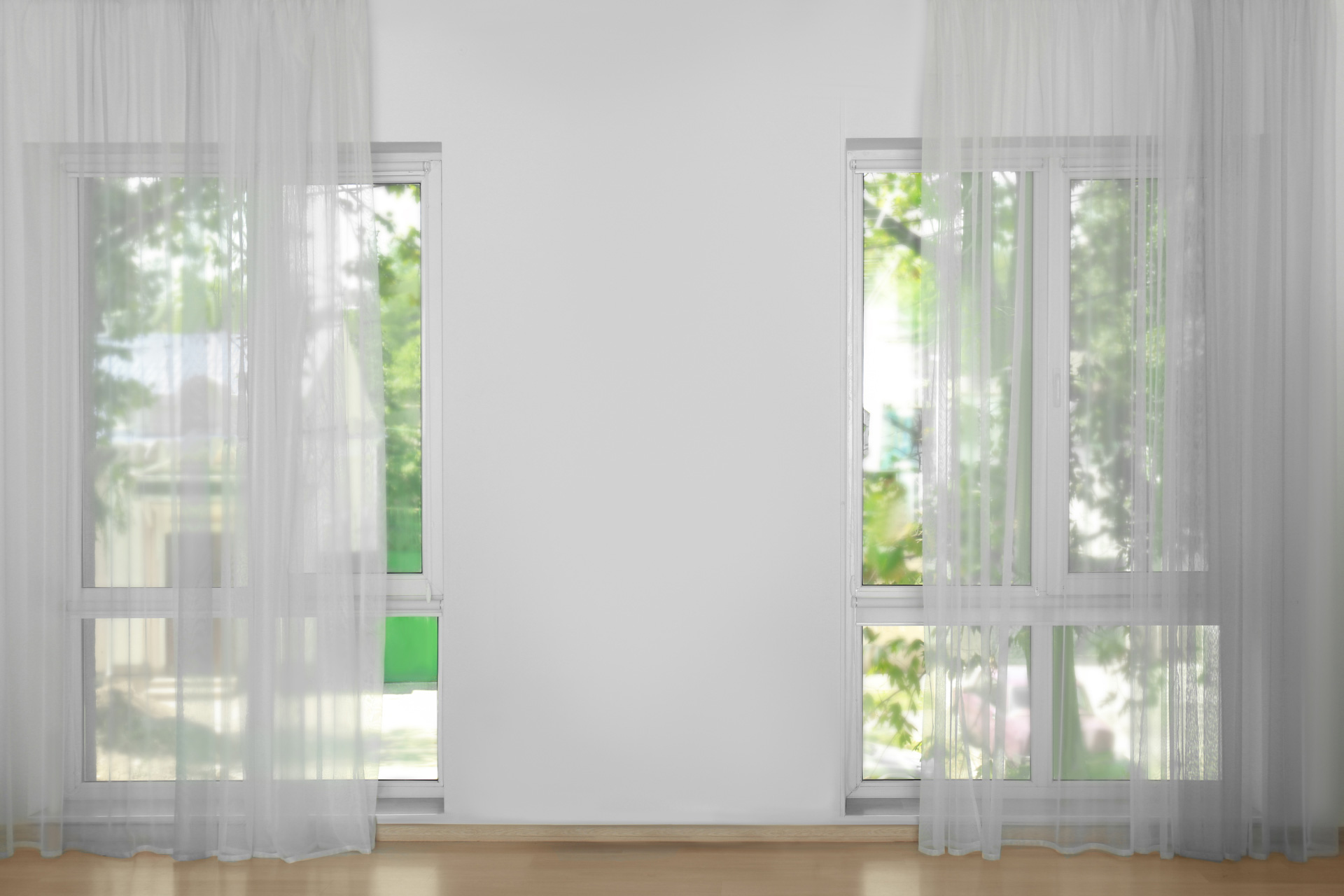 Sheer curtains covering glass windows