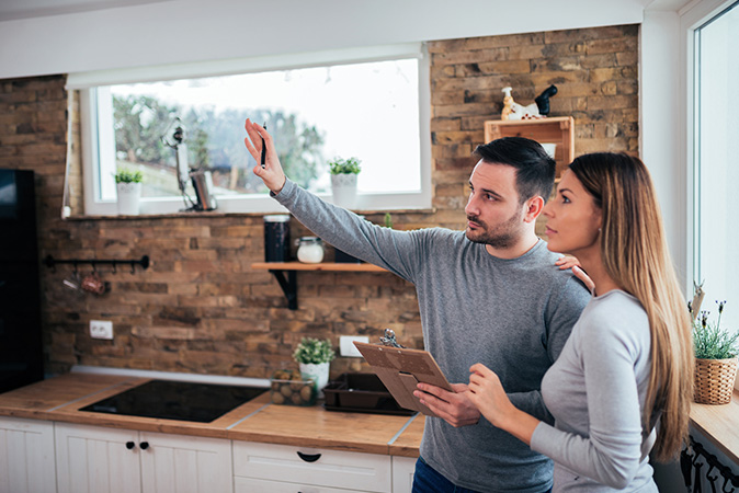 People planning renovations inside the kitchen