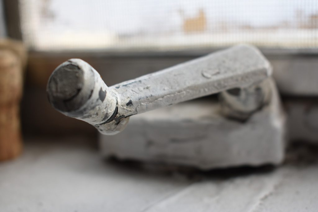 Close-up of old window crank
