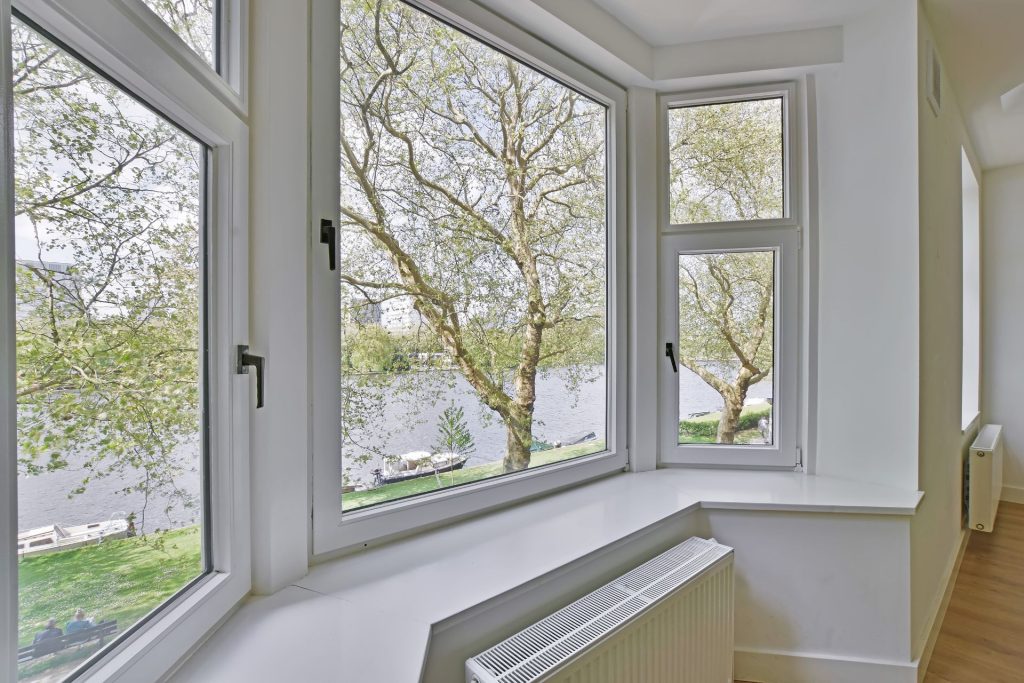 A casement bay window style in vinyl white