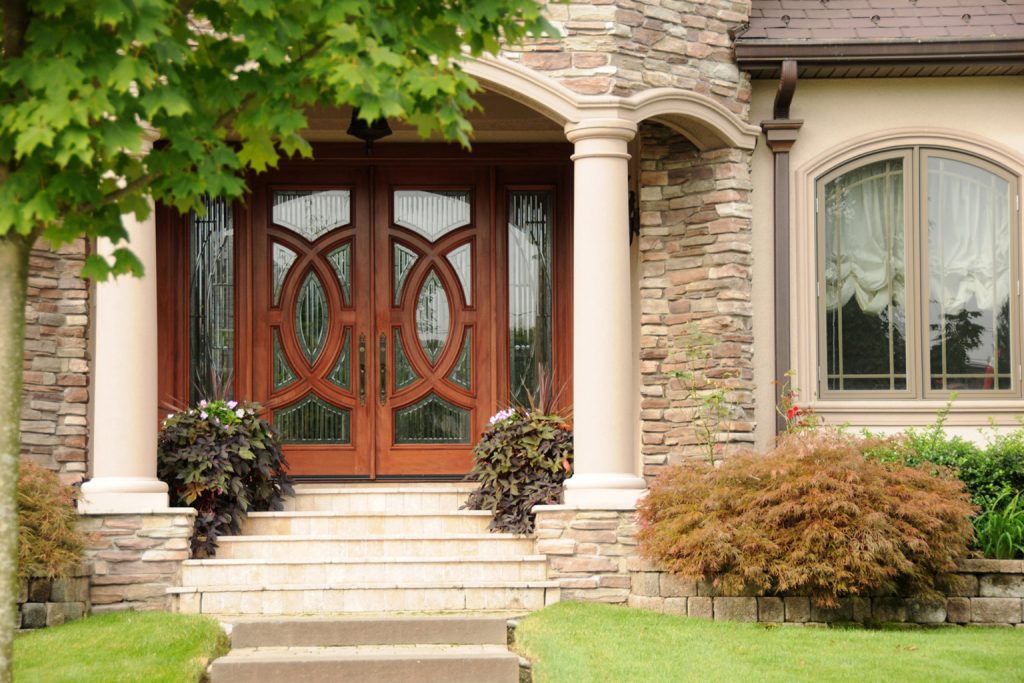 House with wooden double door and sidelights 