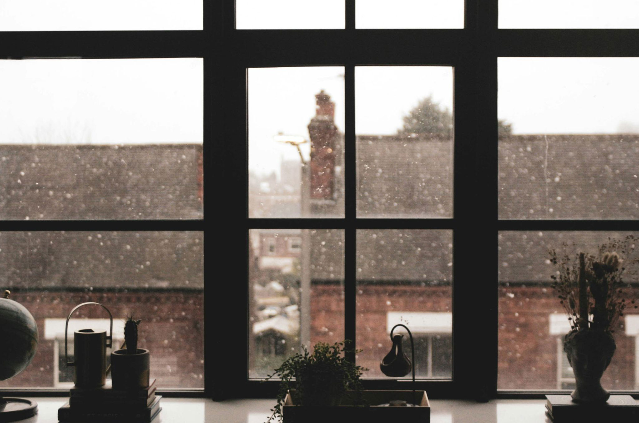 A window looking out at the neighbourhood during winter
