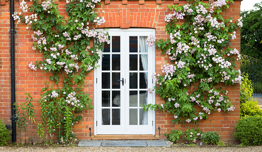 White exterior French doors in a brick house