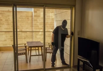 A burglar breaks into a house that needs better patio door security