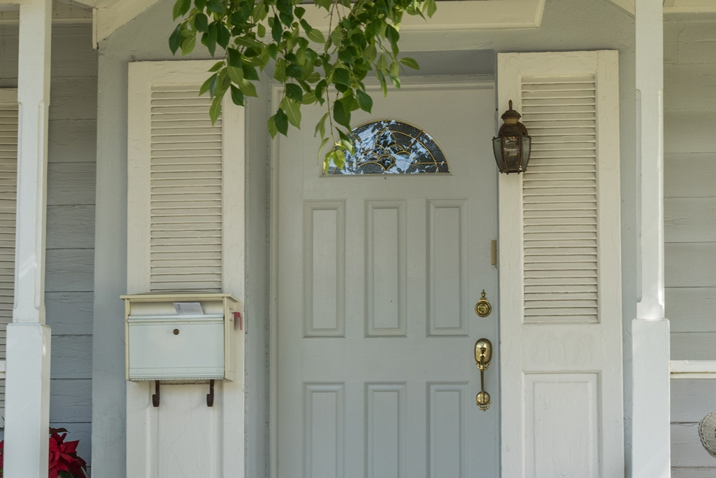 Exterior door with half-moon glass inserts